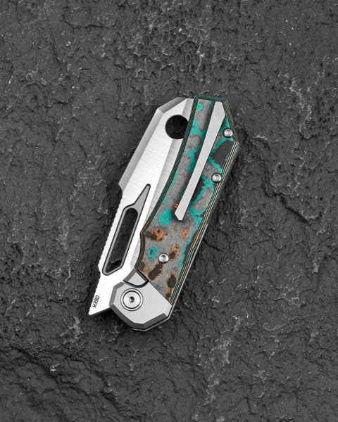 BESTECH NYRRDREKI BT2607C Titanium with Shipwreck Camo Carbon Inlays Handle: 3.08" M390 Blade, Thumb Hole, Front Flipper with Button Bolster Lock, Hollow Grind